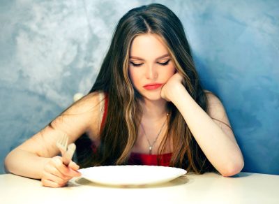 Hungry woman skipping meal