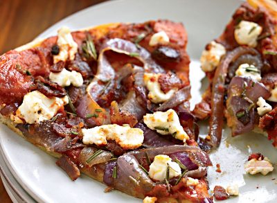 Healthy bacon pizza with caramelized onions and goat cheese