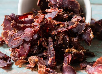 shred of biltong spilling out of white bowl