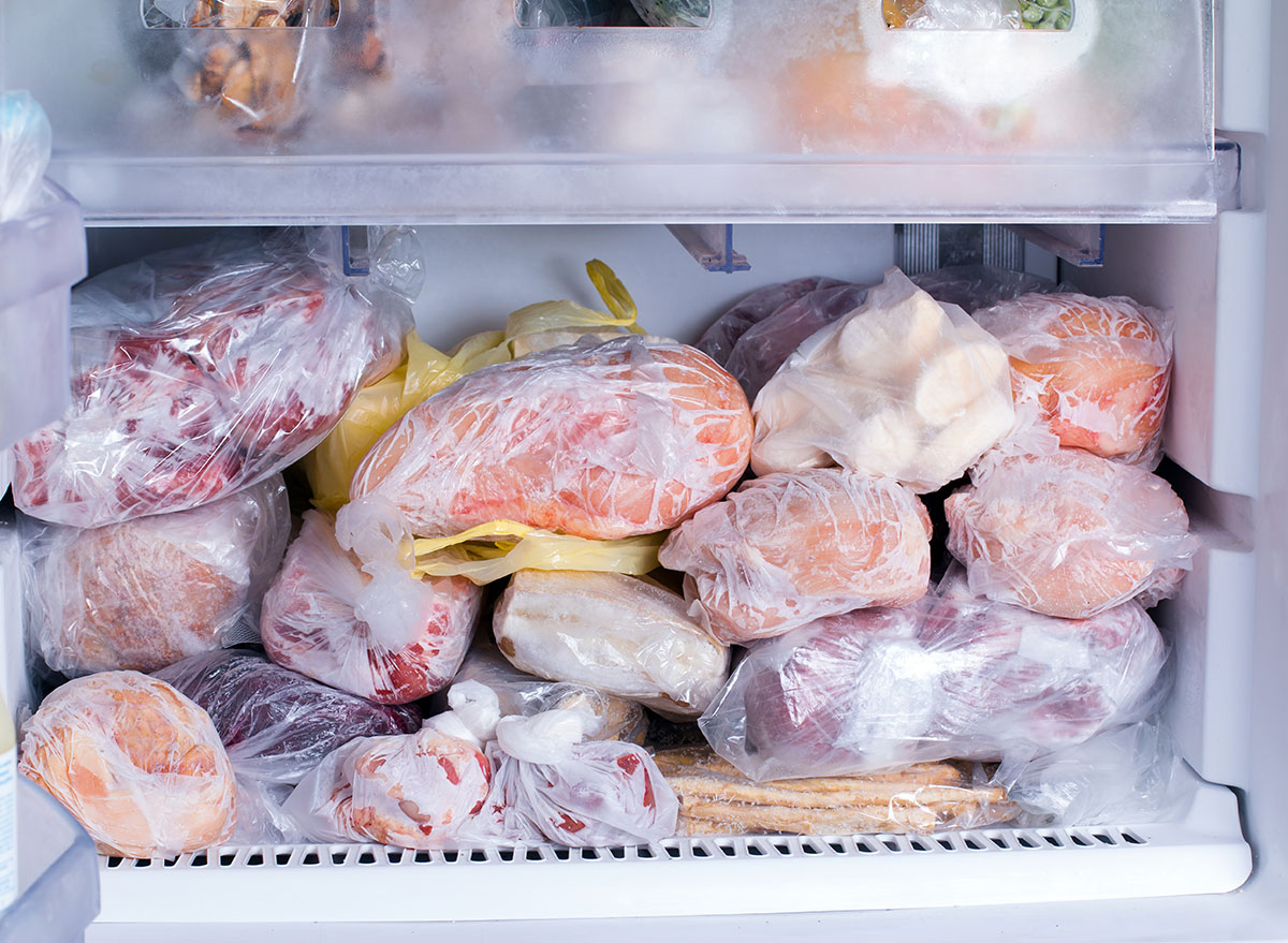 Frozen food in the freezer. Bagged frozen meat and other foods in