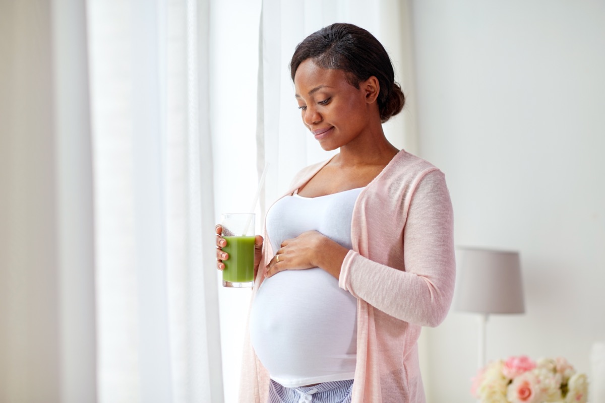 https://www.eatthis.com/wp-content/uploads/sites/4/2019/06/pregnant-woman-smoothie-juice.jpg?quality=82&strip=1