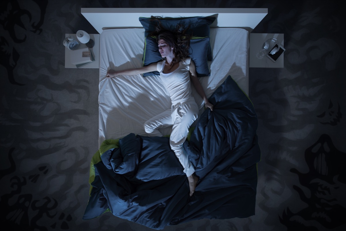 woman in bed restless,