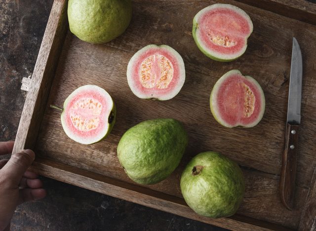 fresh guava slices with knife