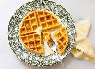 Biting into a keto waffle