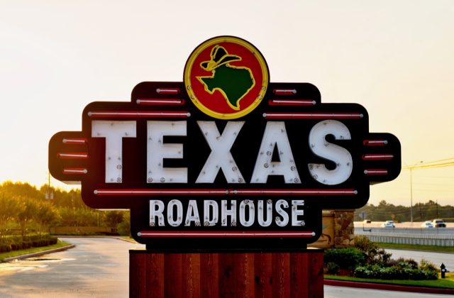 texas roadhouse sign at sunset