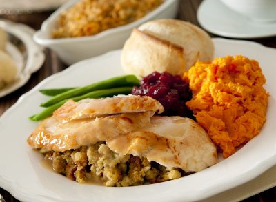 Traditional Thanksgiving dinner served on white oval plate