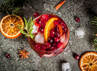 christmas cocktail with cranberries and orange