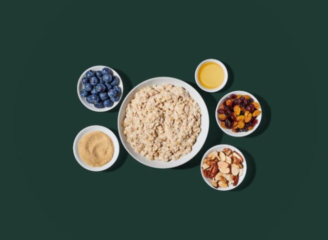 Starbucks oatmeal and toppings on a green background