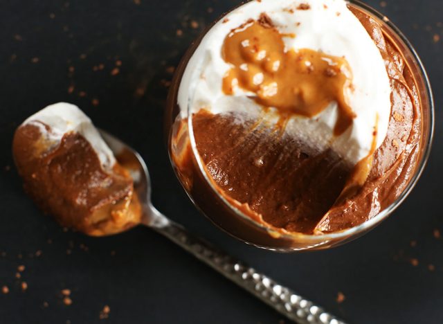 chocolate peanut butter avocado pudding with spoon