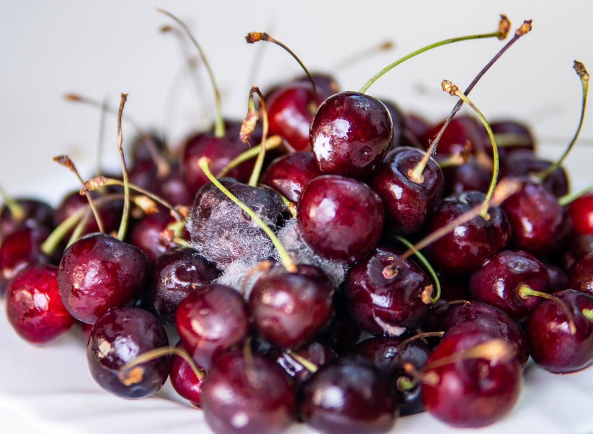 https://www.eatthis.com/wp-content/uploads/sites/4/2020/02/moldy-cherries.jpg?quality=82&strip=1