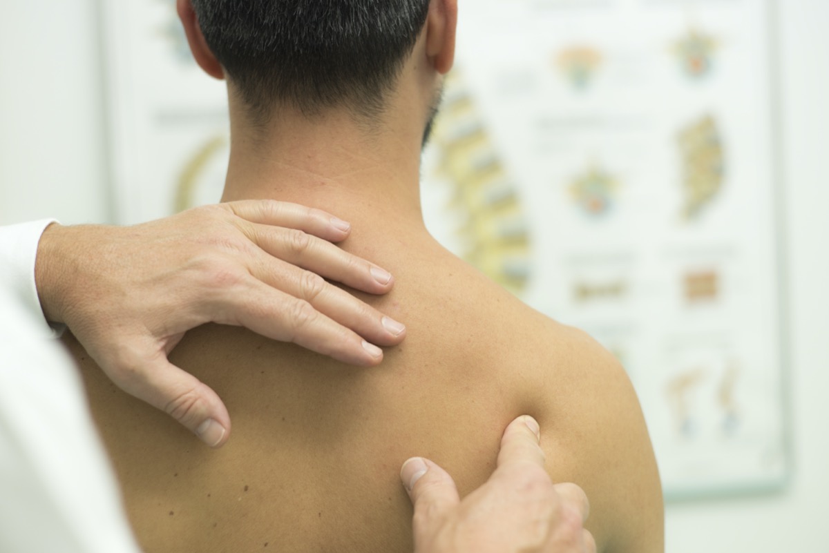 Medical check at the shoulder during a physiotherapy examination