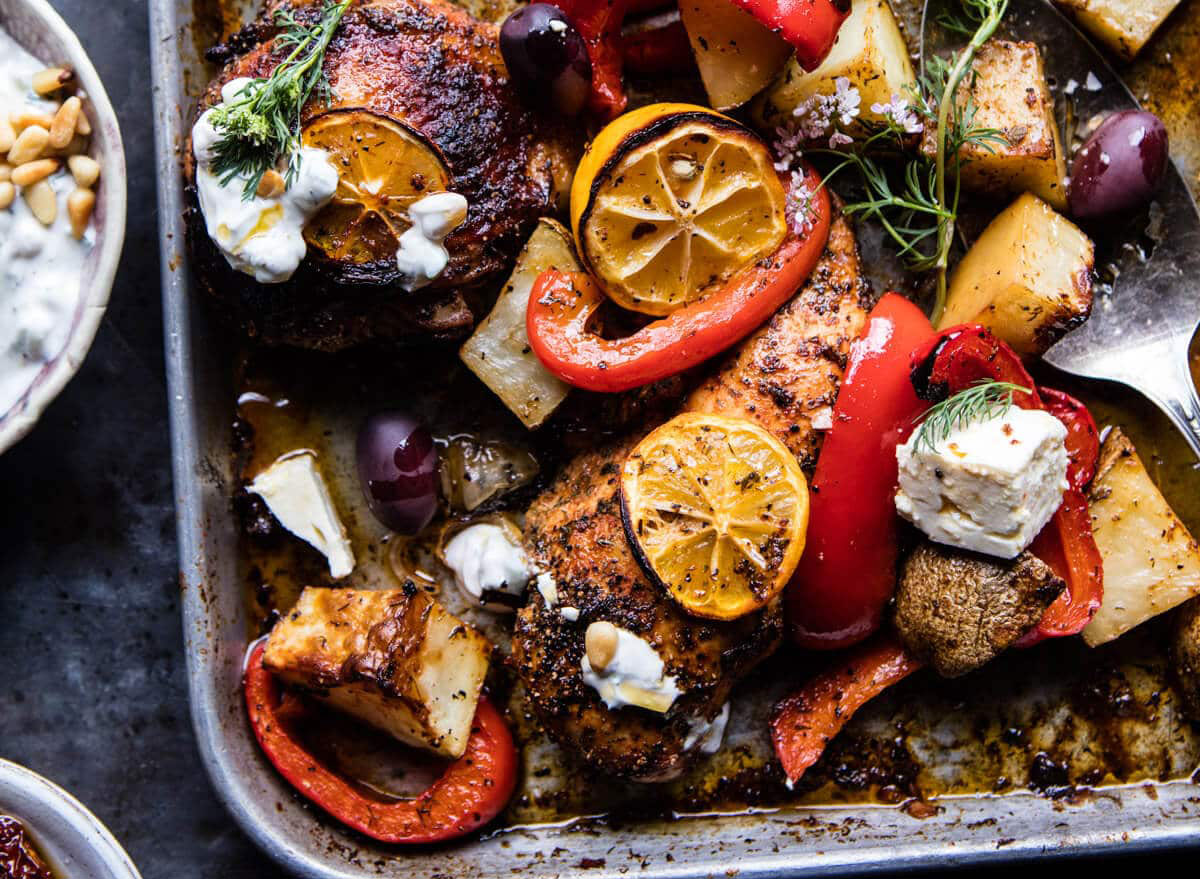 https://www.eatthis.com/wp-content/uploads/sites/4/2020/04/Greek-Sheet-Pan-Chicken-Souvlaki-and-Potatoes-half-baked-harvest.jpg