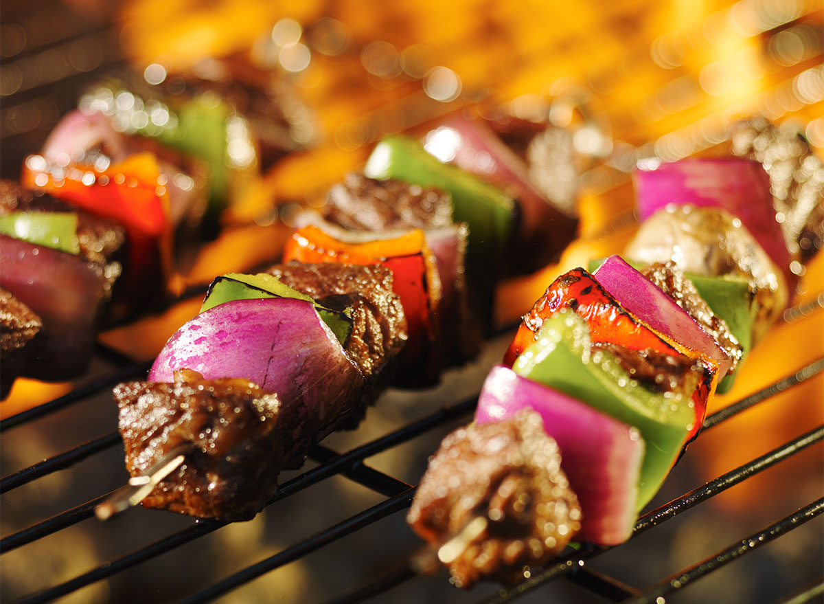 steak and vegetable kabobs on grill