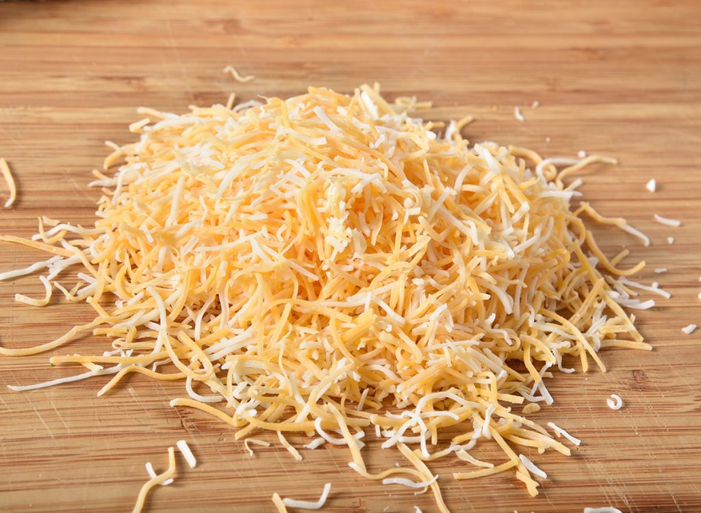 The Hidden Ingredient In Shredded Cheese Eat This Not That