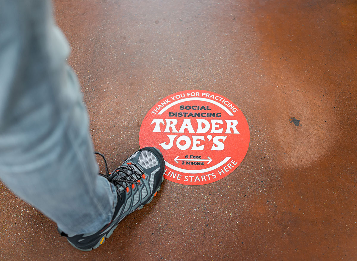 social distancing floor sign at trader joes