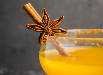 pumpkin spice cocktail with a cinnamon stick