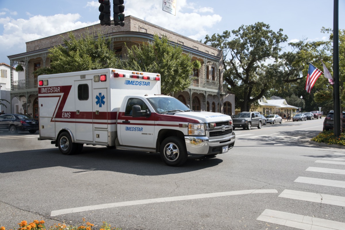 An ambulance on an emergency call crossing downtown Fairhope
