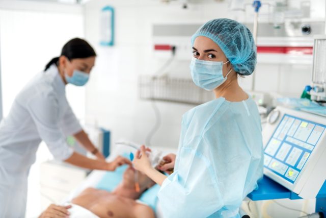 female medical worker in protective mask