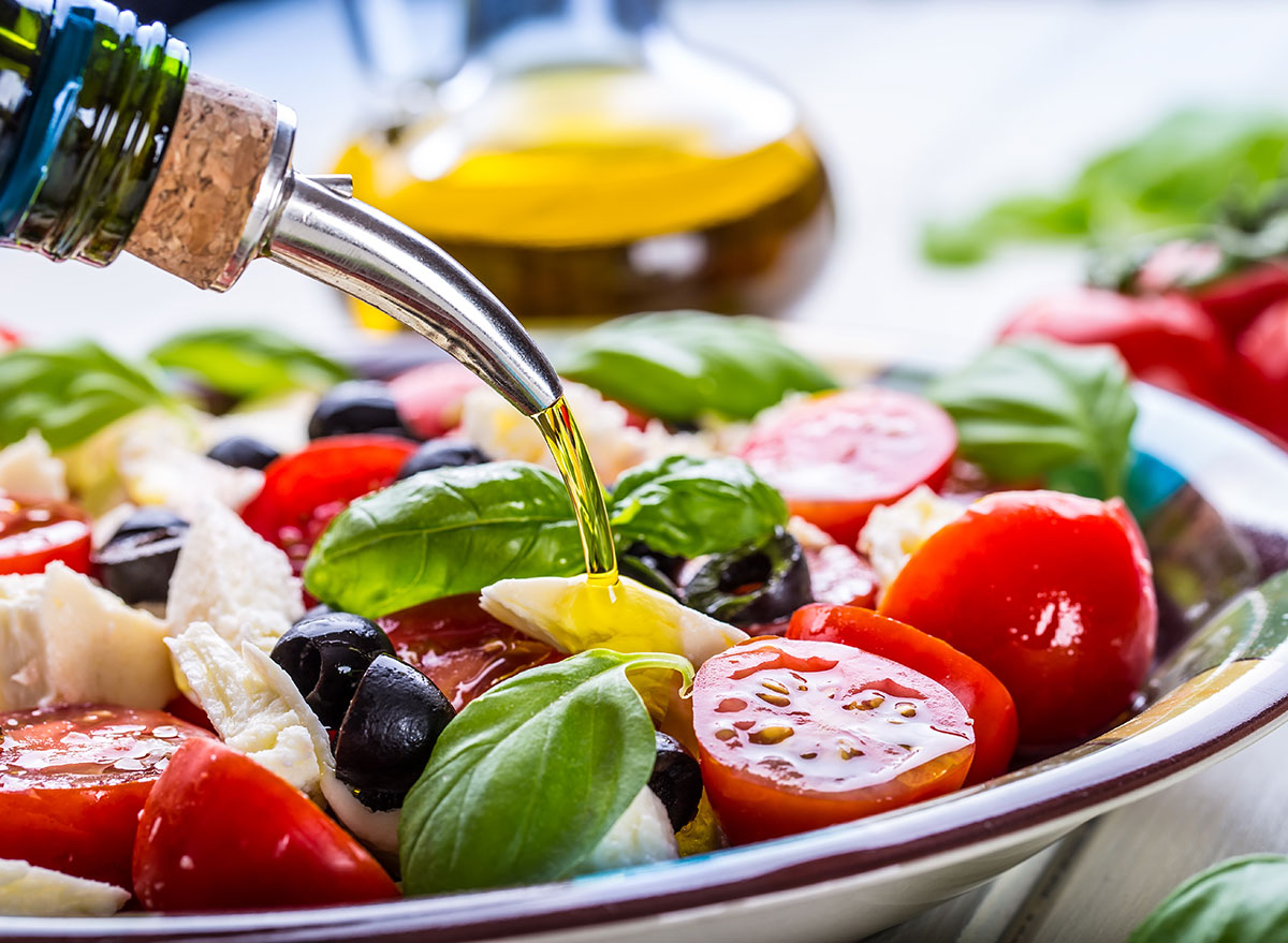 Is Olive Oil Good for You - olive oil on salad