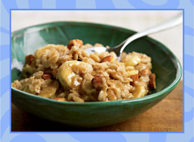 oatmeal with bananas almonds and peanut butter in a bowl with a blue border