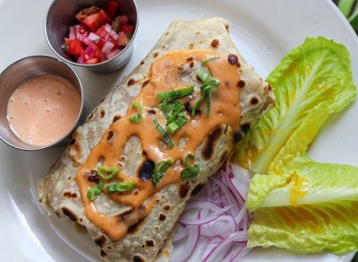 new orleans roll with lettuce and dipping sauce