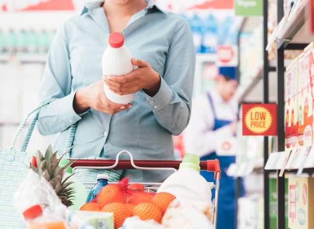 woman reading food label