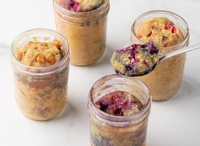 four Mason jars of mug cakes