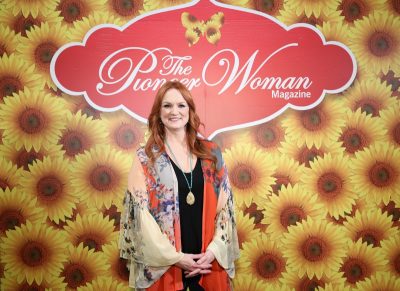 ree drummond in front of floral bakcdrop