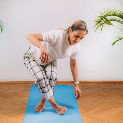 Woman Doing Sitting and Rising Test at Home