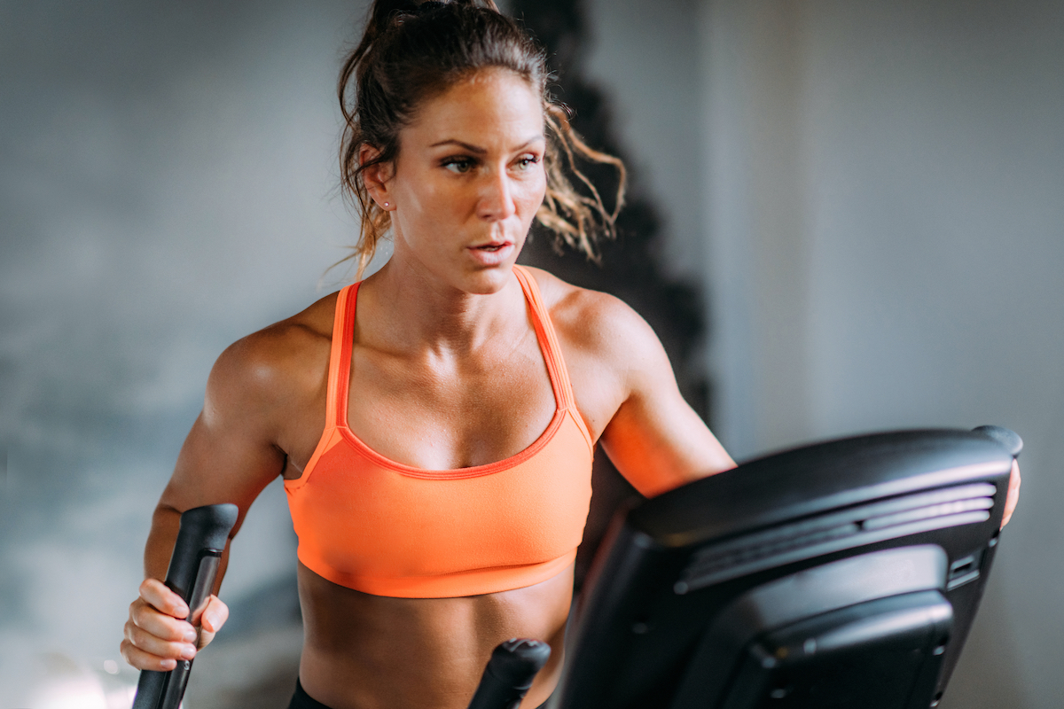 https://www.eatthis.com/wp-content/uploads/sites/4/2021/06/woman-on-elliptical.jpg?quality=82&strip=1