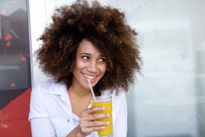 young woman drinking juice