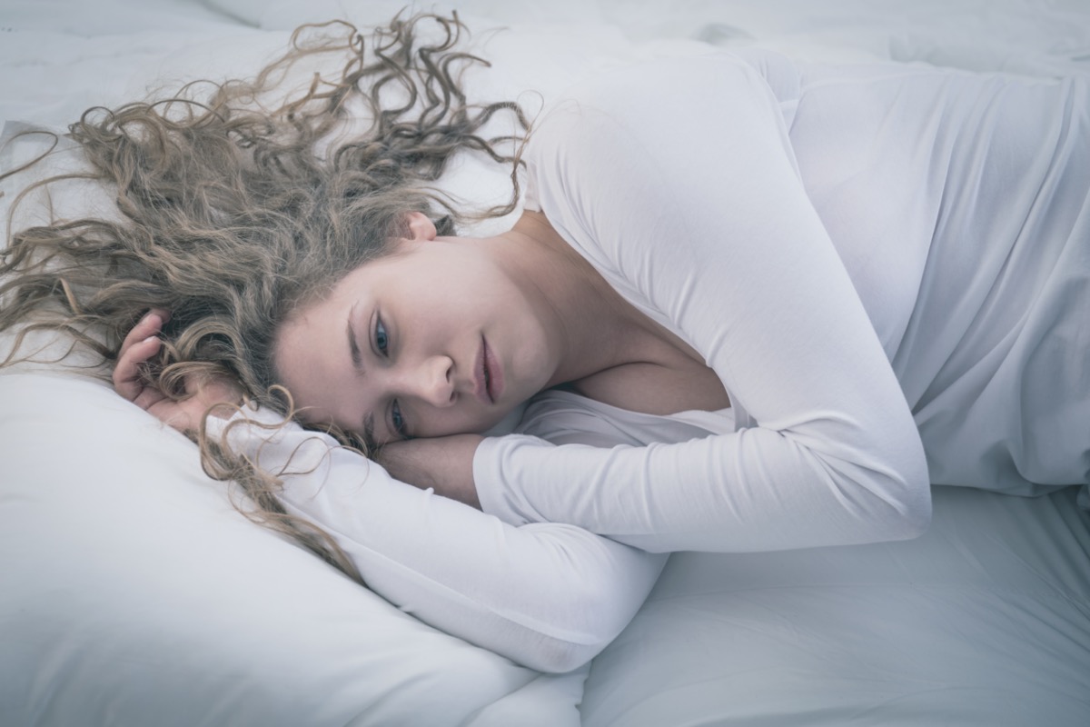 Woman lying at bed.