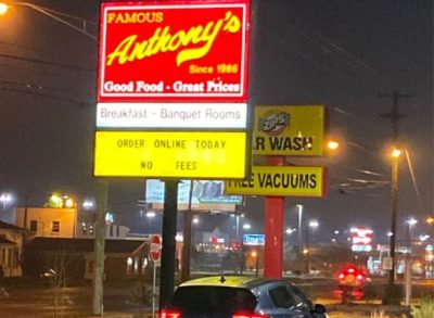 famous anthony's restaurant exterior at night with illuminated sign