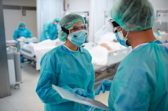 Two healthcare workers talking at the UCI