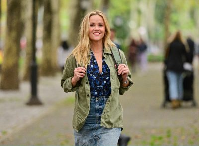 Reese Witherspoon walking outside with backpack in Brooklyn