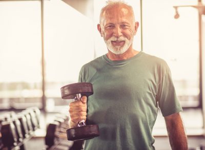 senior man holding weight