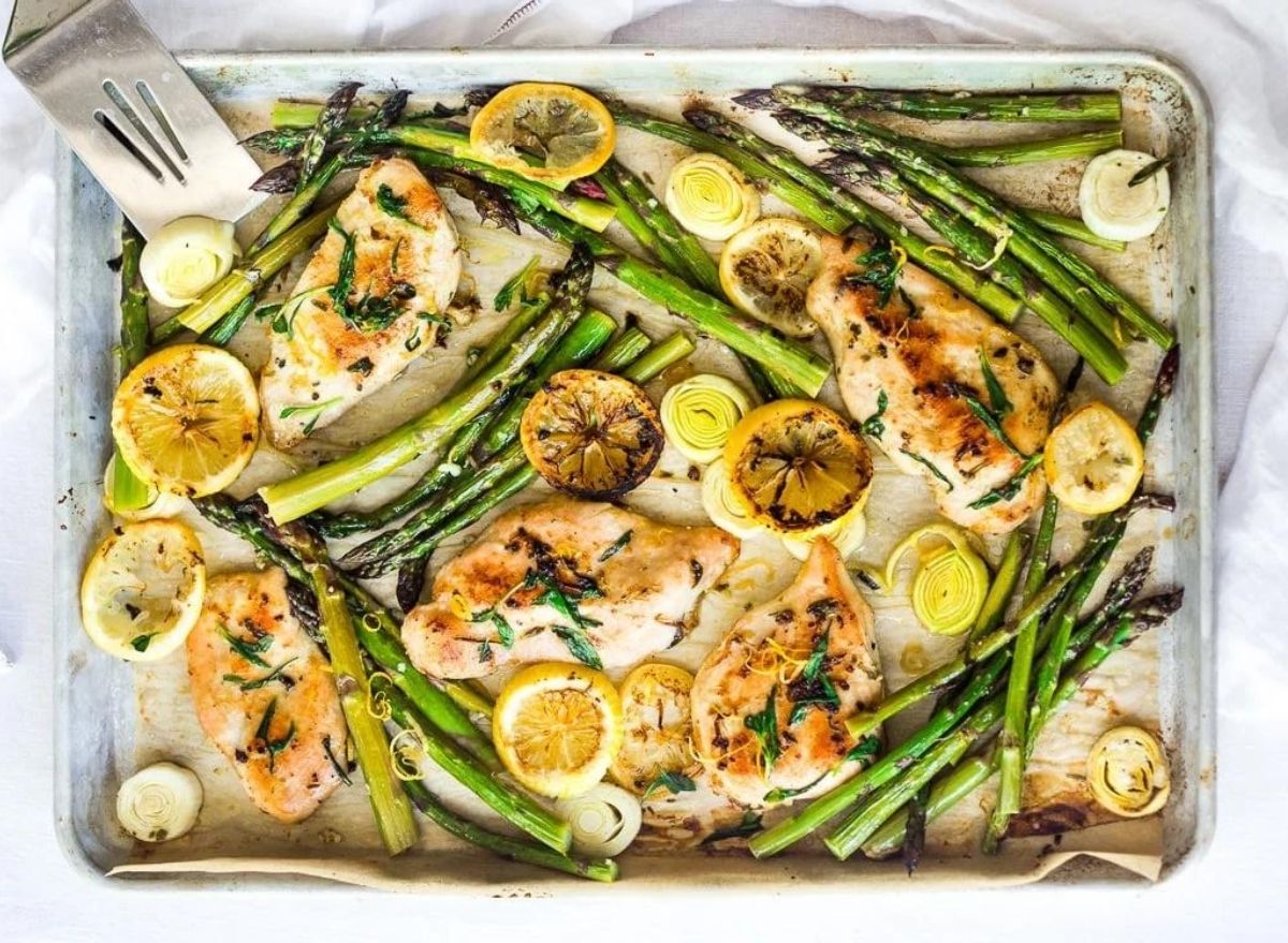 https://www.eatthis.com/wp-content/uploads/sites/4/2022/02/Tarragon-Chicken-with-Asparagus.jpg?quality=82&strip=all