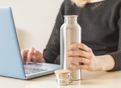 woman holding water bottle