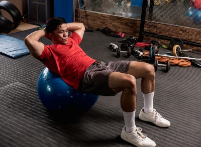 man doing crunches with stability ball