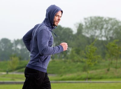 man in 40s getting cardio in outdoors