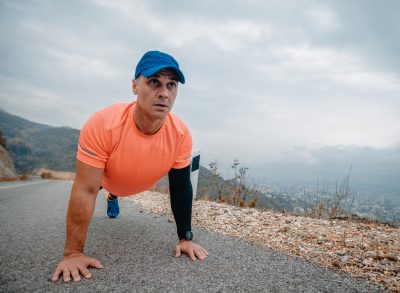 man doing plank outside