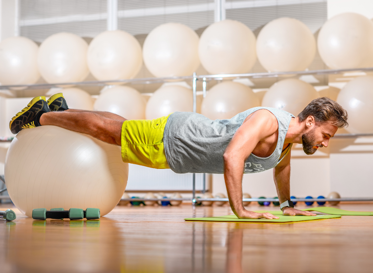 https://www.eatthis.com/wp-content/uploads/sites/4/2022/04/man-stability-ball-exercises.jpg?quality=82&strip=1