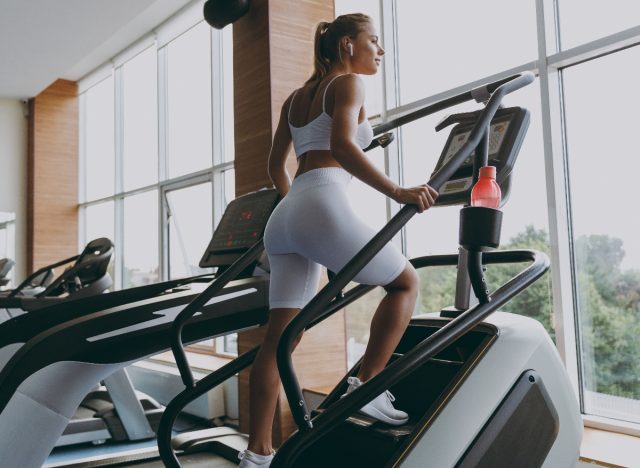 Young woman doing stair climber to jump start weight loss