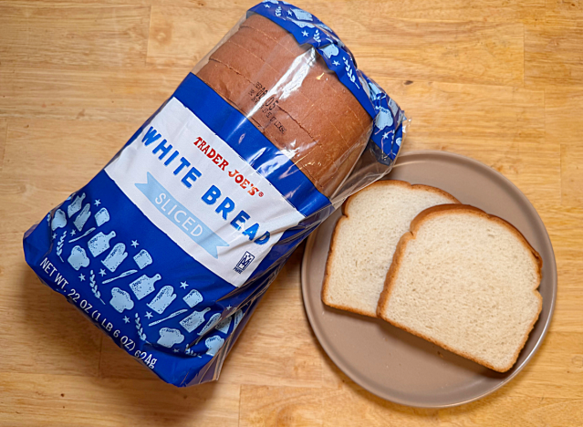 a loaf of trader joe's bread with two slices on a plate