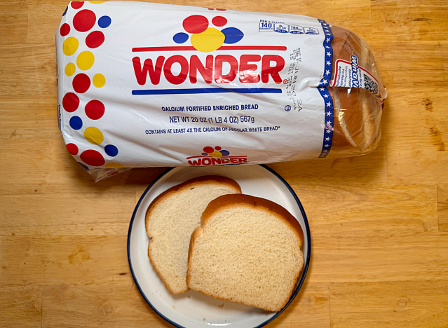 loaf of wonder bread with two slices on a plate 