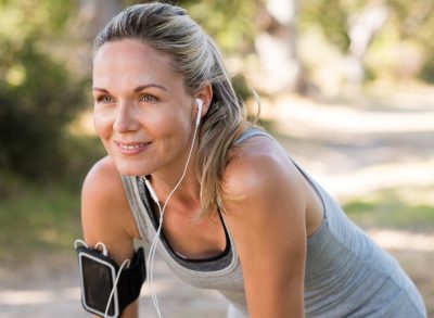 mature athletic woman exercising outdoors to get a lean body after 50