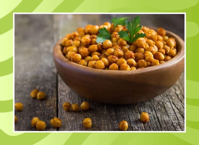 bowl of chickpeas on a green background