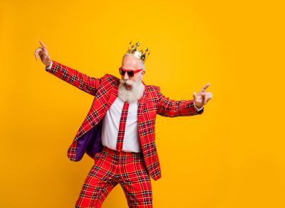 Old man dancing with a crown