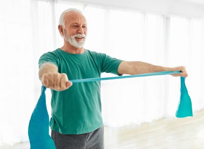 man demonstrating resistance training exercises for seniors