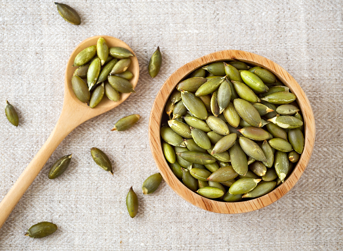 8 Surprising Side Effects Of Eating Pumpkin Seeds Say Dietitians Eat   Bowl Of Pumpkin Seeds 